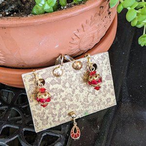 Two pairs of vintage red and golden clip on earrings